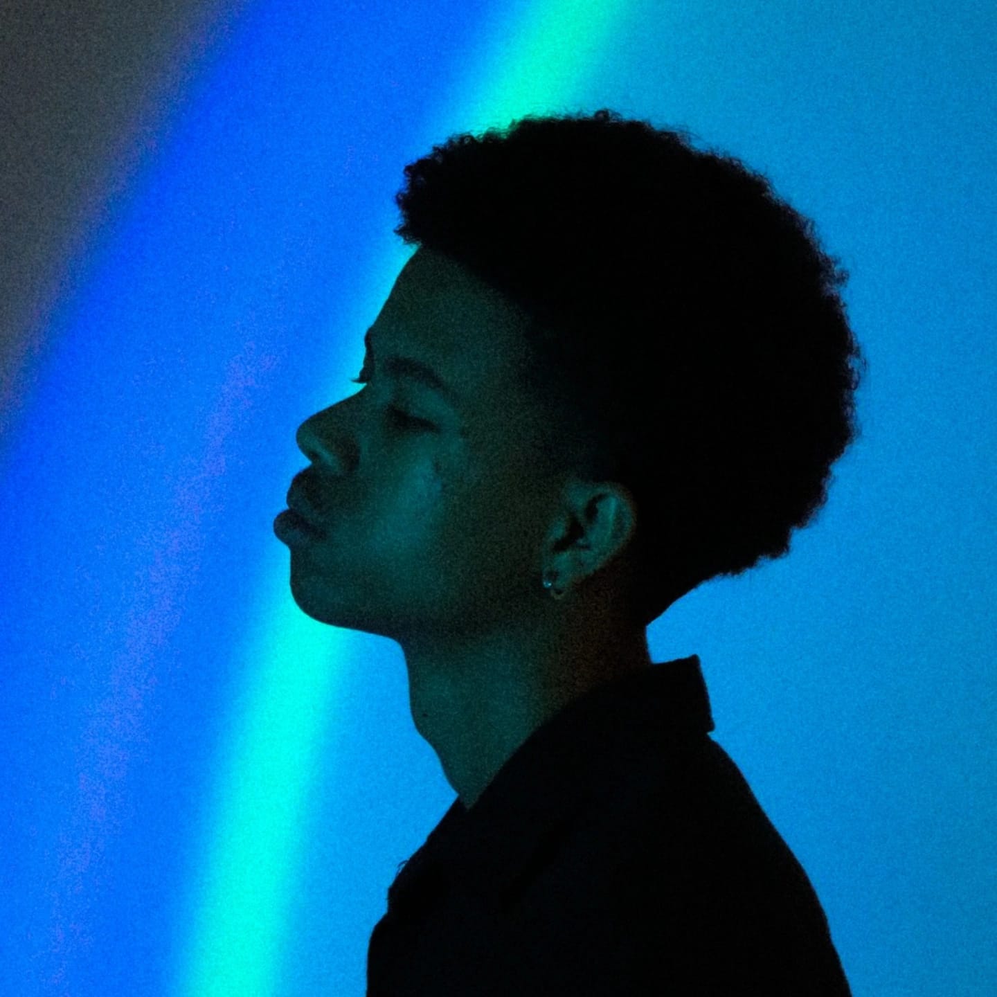 Eljay Adero profile — atmospheric blue lighting